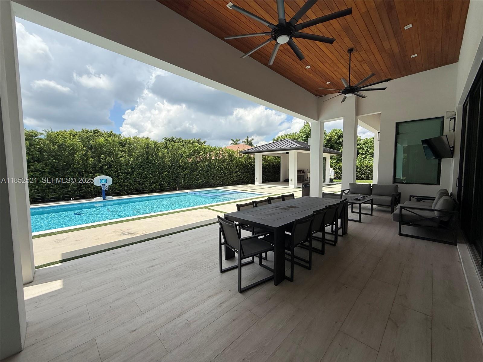 9600 Southwest 66th Street Miami, FL 33173 - Photo 44 of 56 a dining room with furniture and garden view