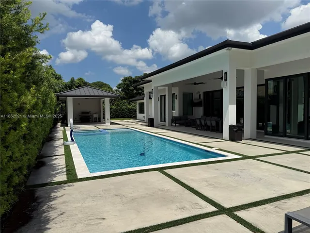 a view of a back yard of the house