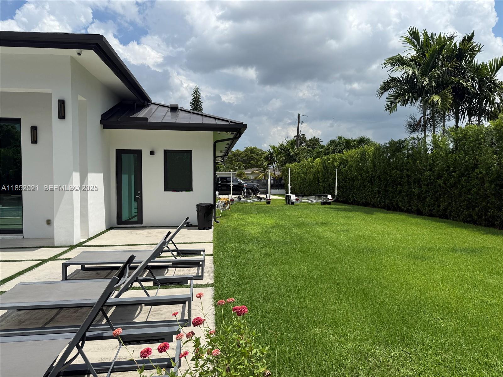 9600 Southwest 66th Street Miami, FL 33173 - Photo 53 of 56 a view of a patio with table and chairs and potted plants