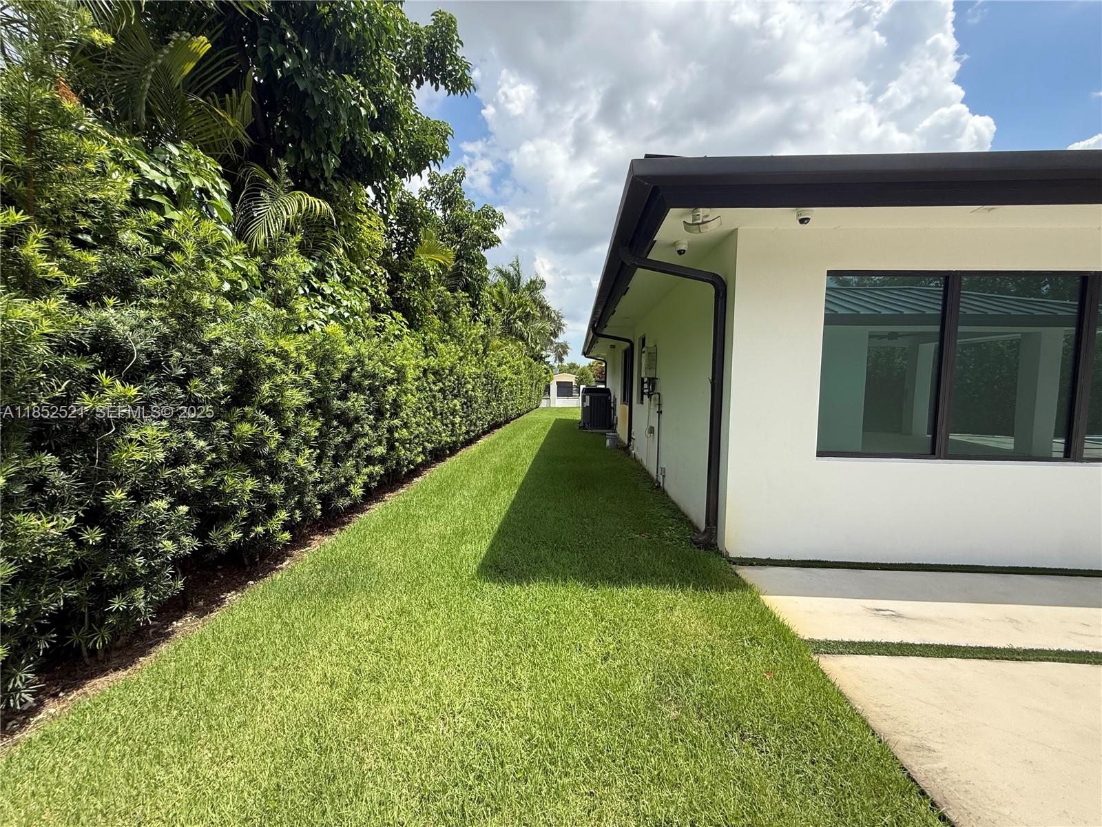 9600 Southwest 66th Street Miami, FL 33173 - Photo 54 of 56 a view of a back yard of the house