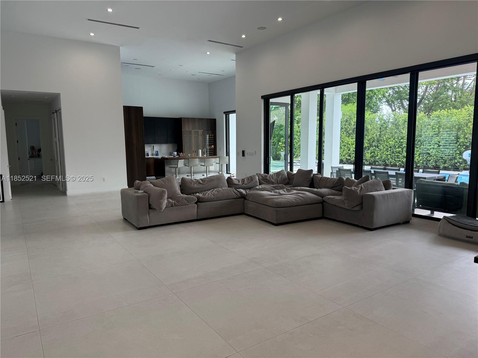 9600 Southwest 66th Street Miami, FL 33173 - Photo 6 of 56 a living room with furniture and large windows