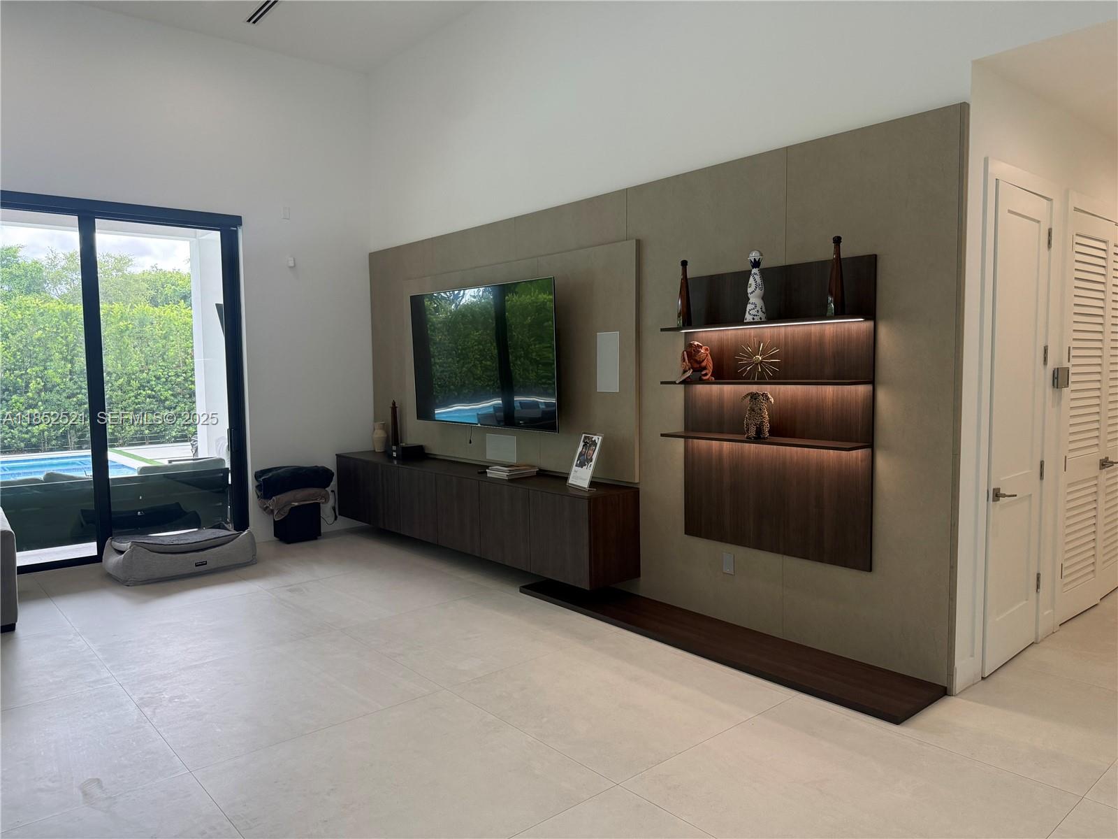 9600 Southwest 66th Street Miami, FL 33173 - Photo 8 of 56 a living room with furniture and a flat screen tv