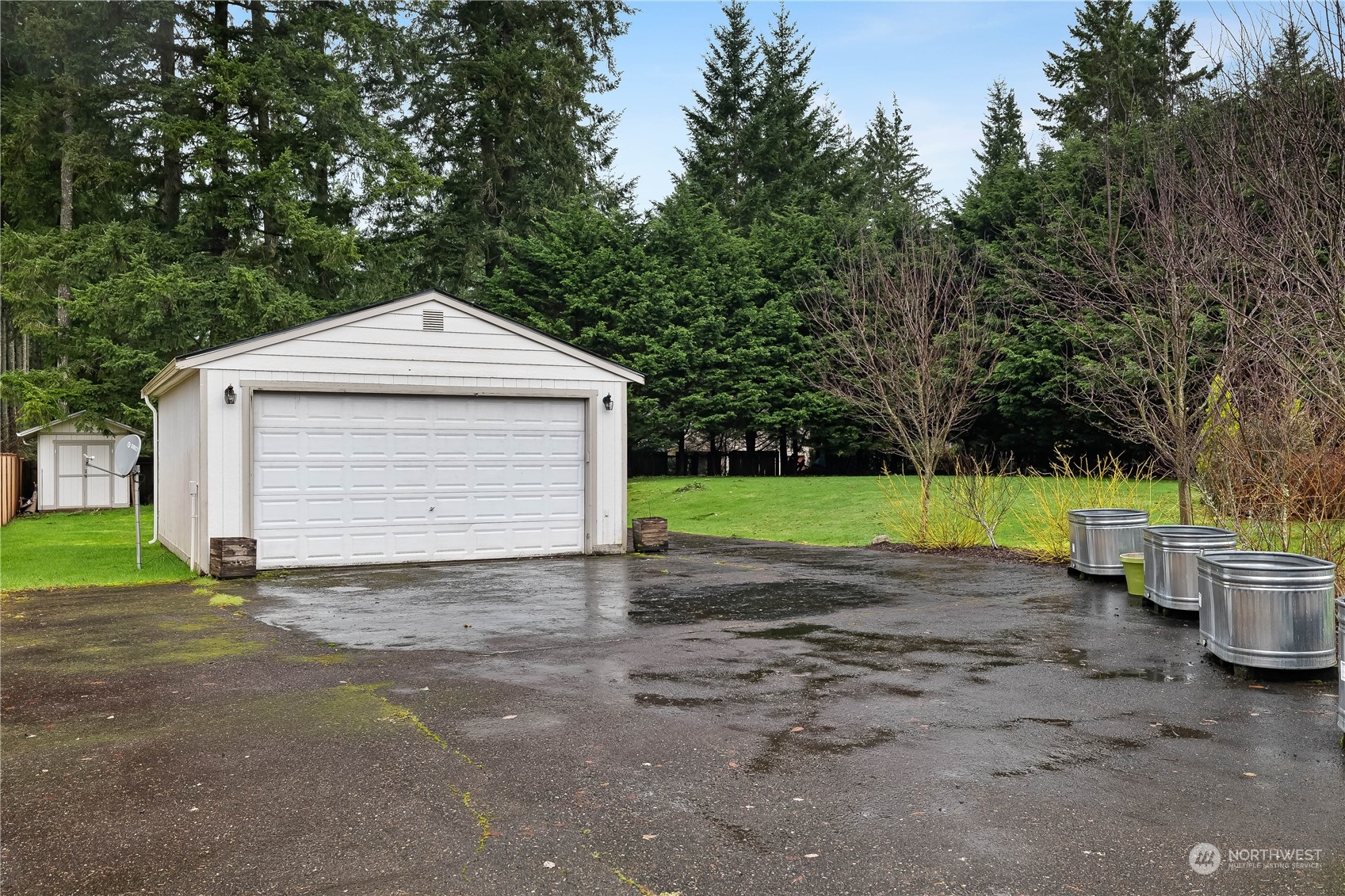 3529 Eagle Drive Northeast Olympia, WA 98516 - Photo 20 of 29 a front view of a house with a yard and garage