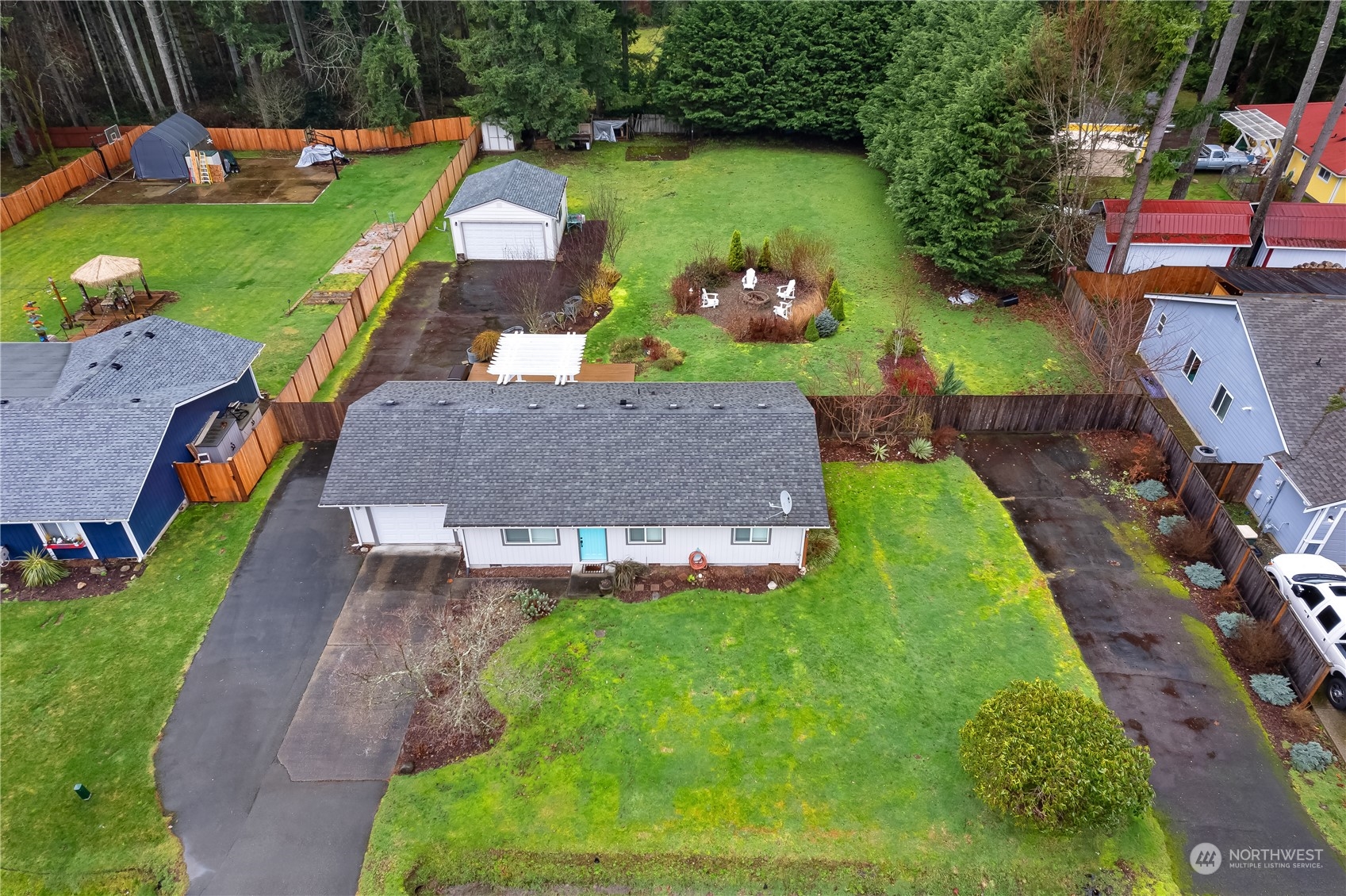3529 Eagle Drive Northeast Olympia, WA 98516 - Photo 2 of 29 an aerial view of a house with a garden and swimming pool