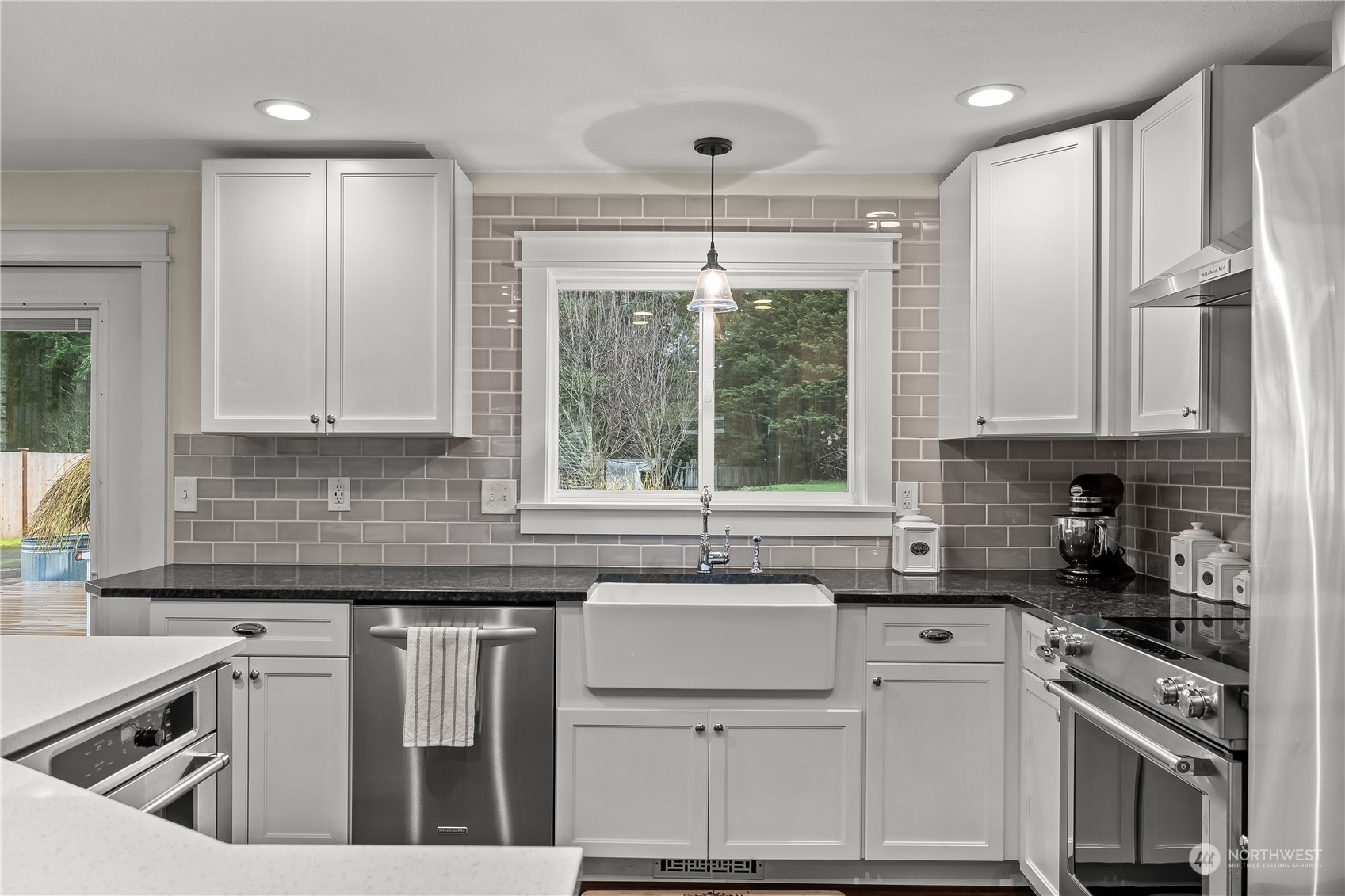 3529 Eagle Drive Northeast Olympia, WA 98516 - Photo 9 of 29 a kitchen with a sink stove and cabinets