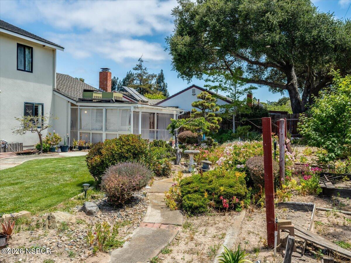 360 Tallyho Road Santa Maria, CA 93455 - Photo 56 of 72 a view of a house with a yard and garden