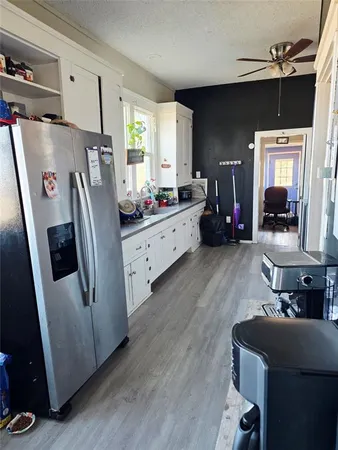 a kitchen with stainless steel appliances a refrigerator and a stove