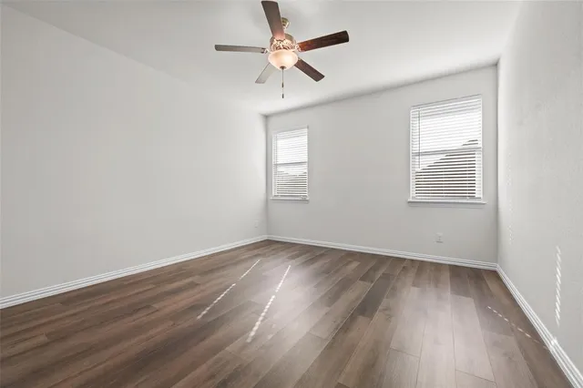 a bathroom with a double vanity sink and mirror