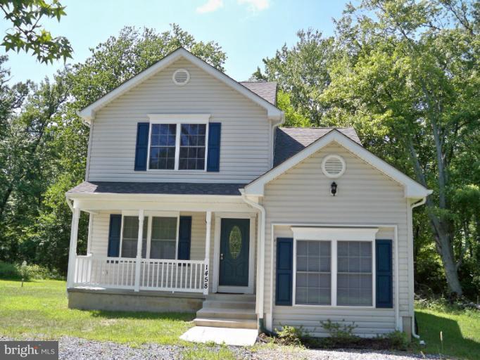 1458 Cox Neck Road Chester, MD 21619 - Photo 1 of 20 a front view of a house with a yard