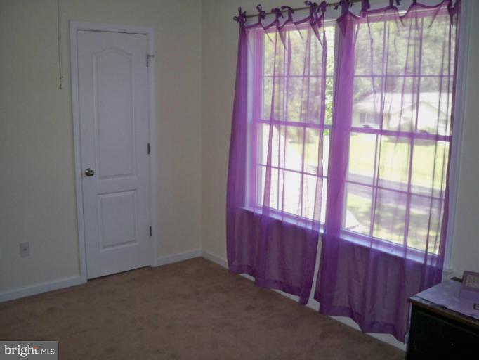 1458 Cox Neck Road Chester, MD 21619 - Photo 20 of 20 a view of a room with large windows