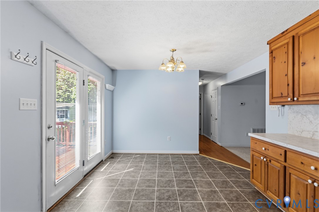 12654 Mt Olive Cohoke Road West Point, VA 23181 - Photo 14 of 31 a view of a kitchen with an empty space and a window