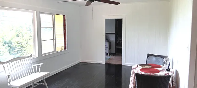 a hallway with furniture and a window