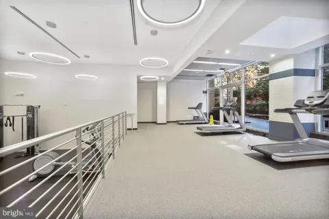 a kitchen with stainless steel appliances a sink and a refrigerator