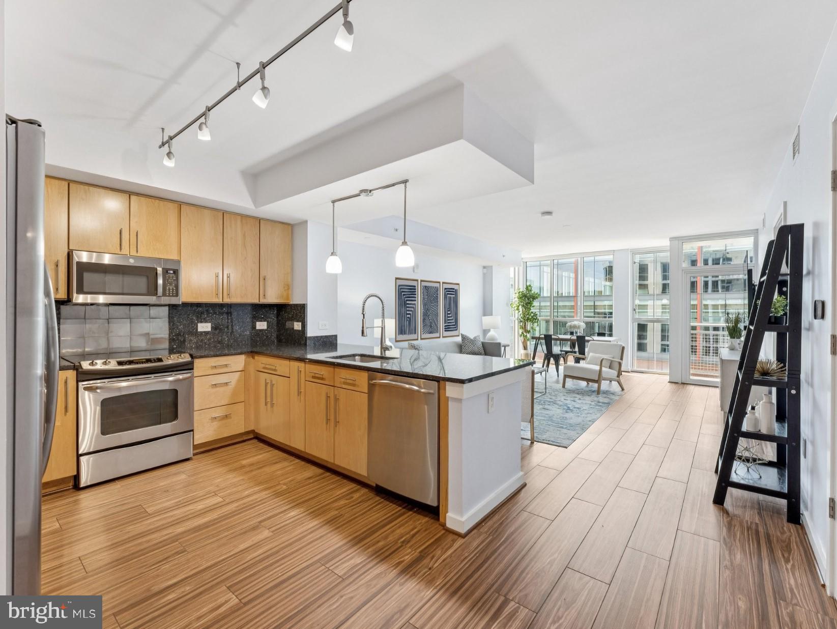 1025 First Street Southeast, Unit 1212 Washington, DC 20003 - Photo 5 of 34 Open plan kitchen overlooks living room