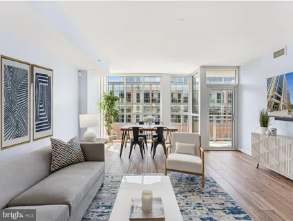 a living room with furniture and a table
