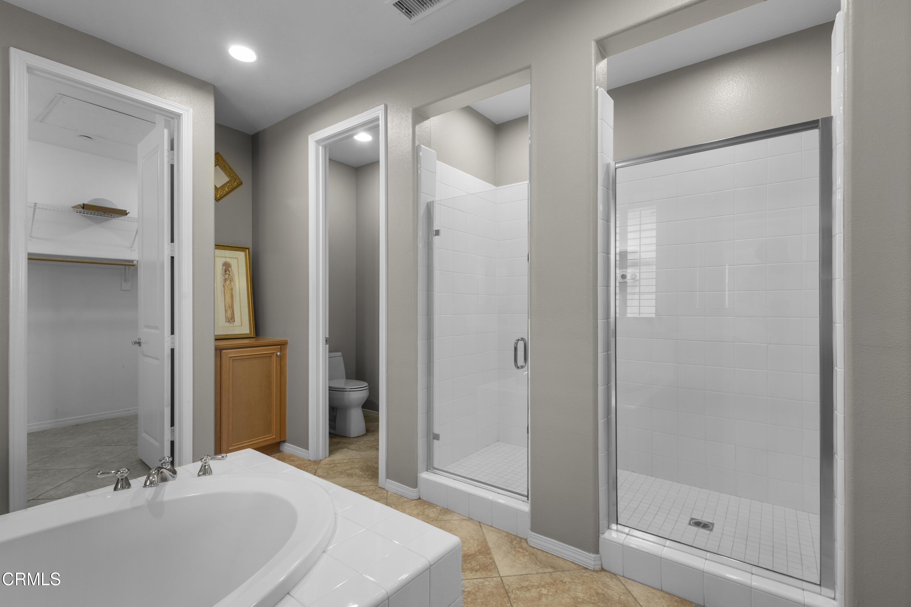 1315 Donegal Way Oxnard, CA 93035 - Photo 29 of 48 a bathroom with a bathtub shower sink and mirror