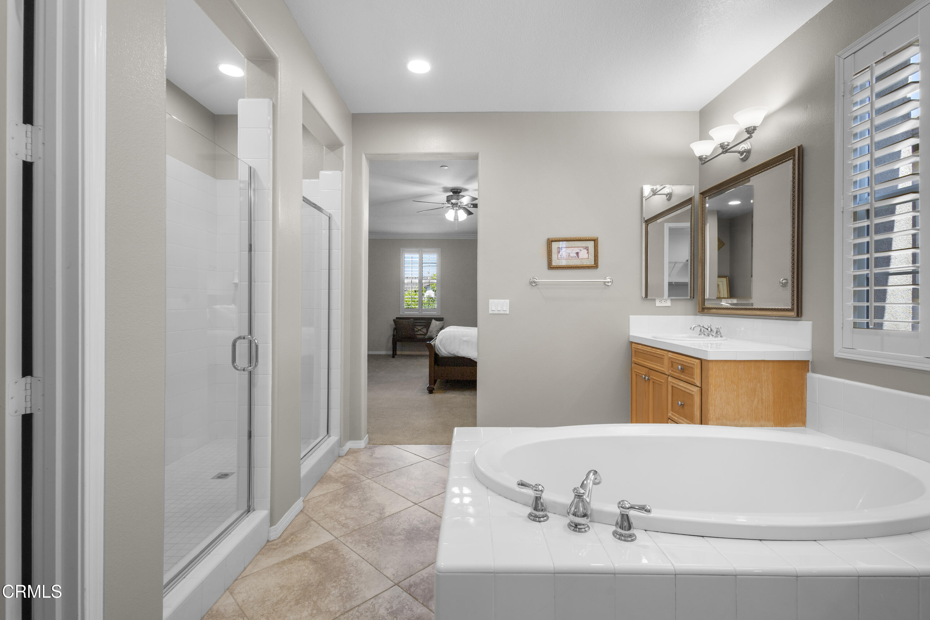 1315 Donegal Way Oxnard, CA 93035 - Photo 31 of 48 a spacious bathroom with a tub sink and mirror