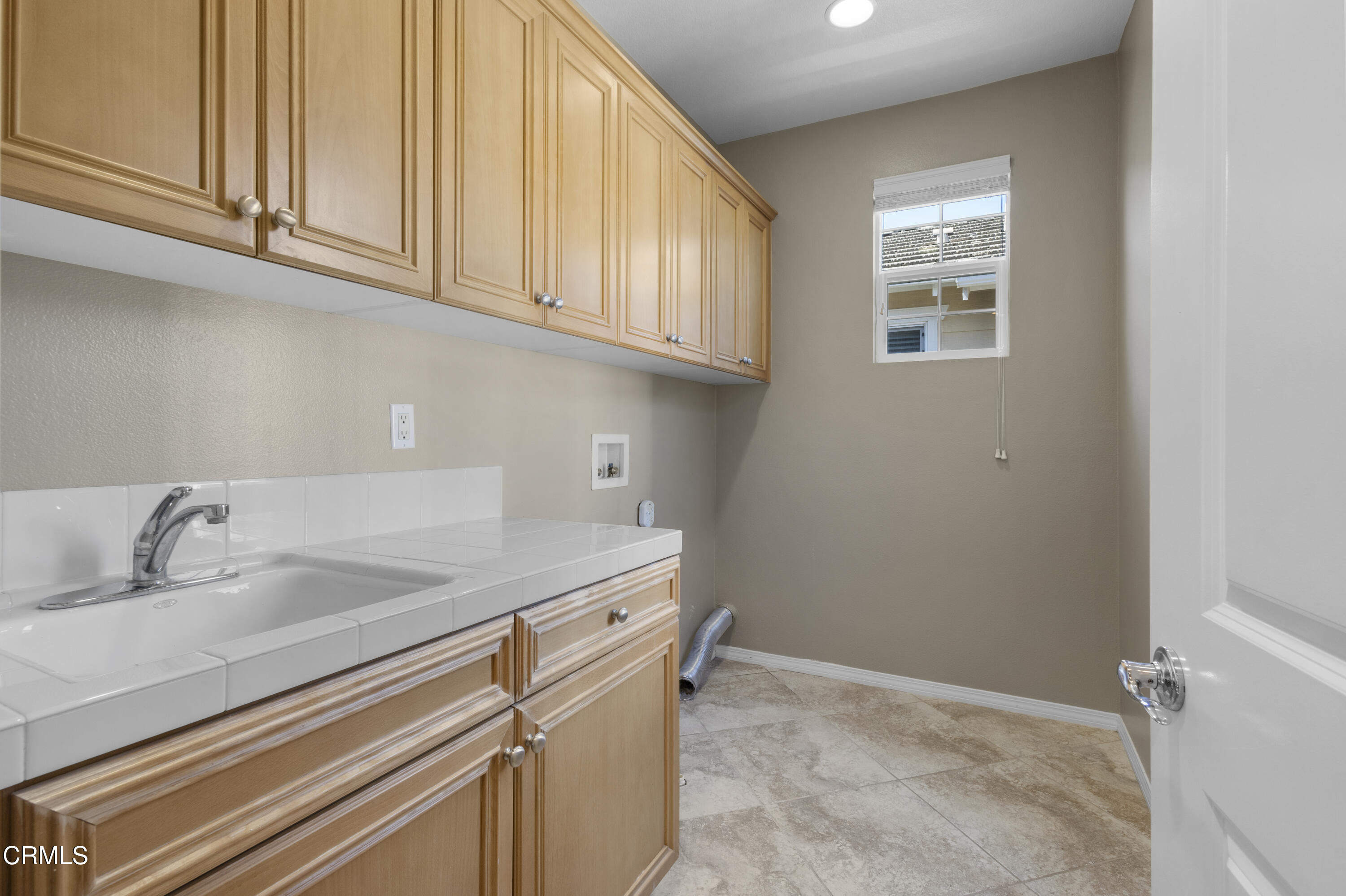 1315 Donegal Way Oxnard, CA 93035 - Photo 35 of 48 a bathroom with a sink and cabinets