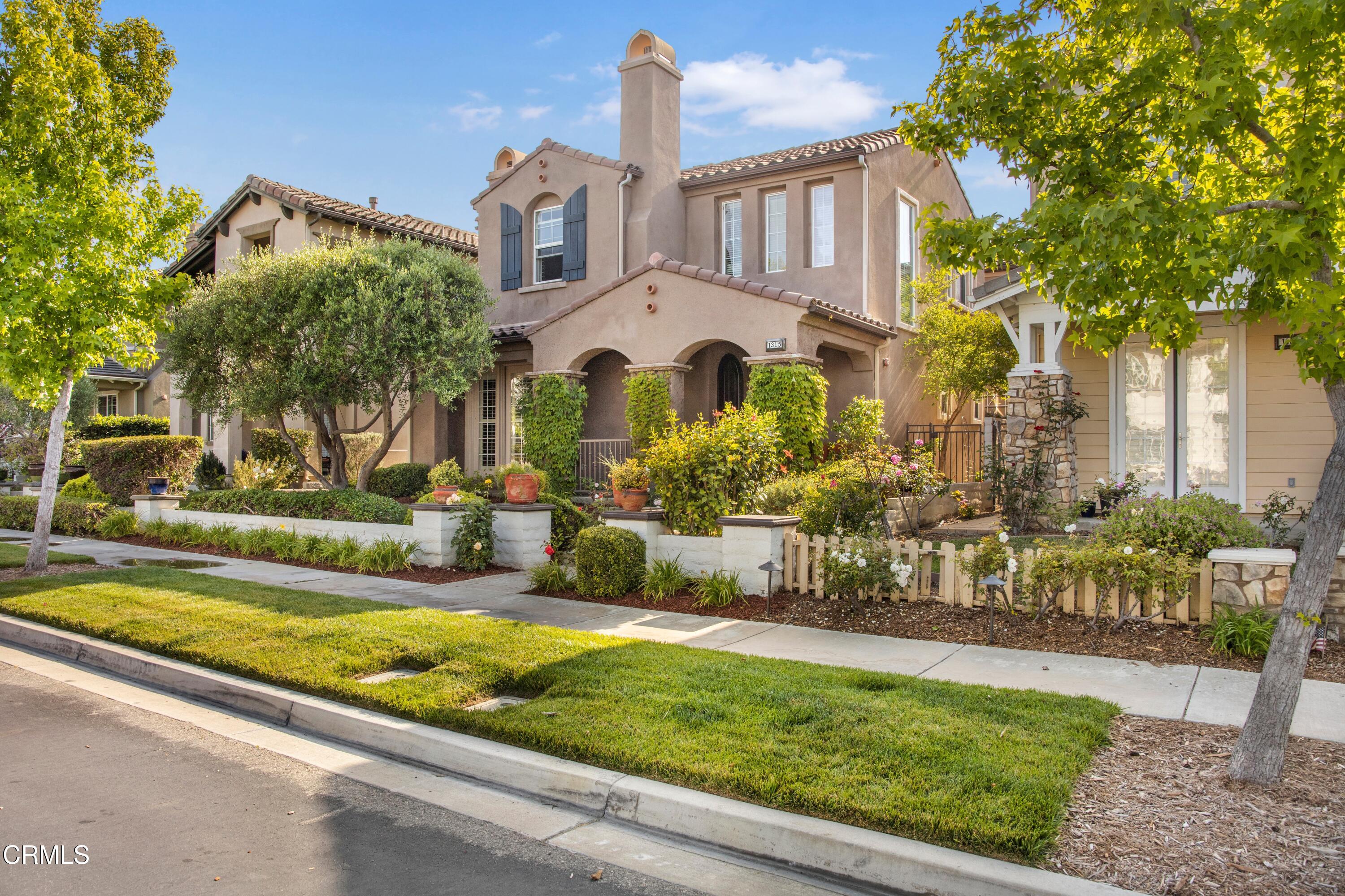 1315 Donegal Way Oxnard, CA 93035 - Photo 41 of 48 a front view of a house with a yard table and chairs