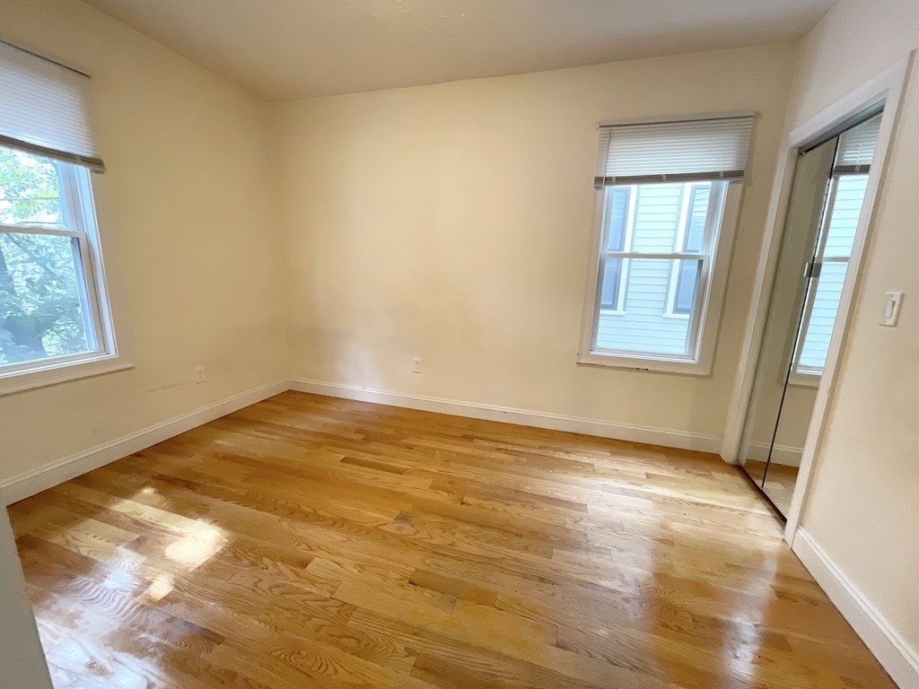 7 Sudan Street, Unit 2 Boston, MA 02125 - Photo 6 of 10 a view of empty room with wooden floor and fan