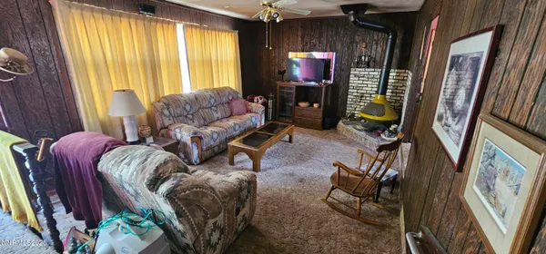a room with furniture a window and wooden floor