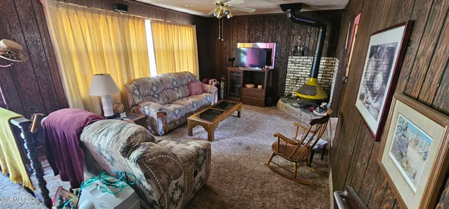 a room with furniture a window and wooden floor