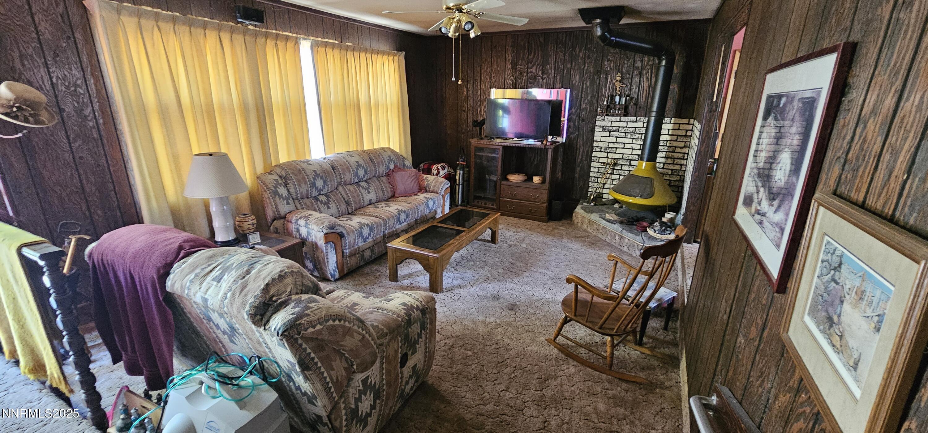 316 Toiyabe Road Kingston, NV 89310 - Photo 12 of 32 a living room with furniture and a flat screen tv
