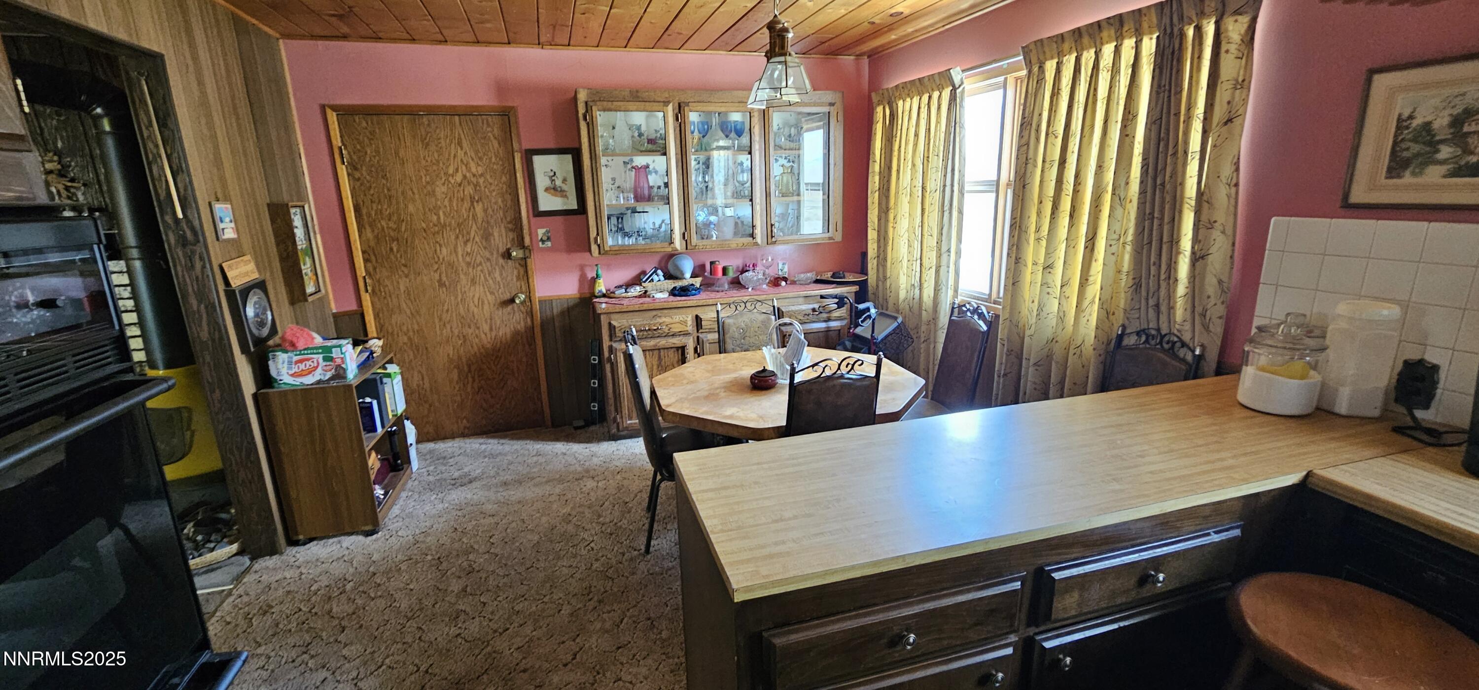 316 Toiyabe Road Kingston, NV 89310 - Photo 15 of 32 a view of a dining room with furniture and a window
