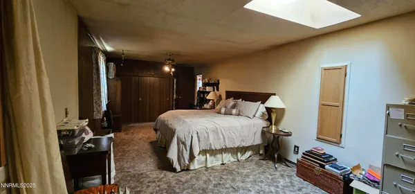 a bed room with a bed and a television