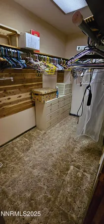 a bedroom with a bed and a mirror