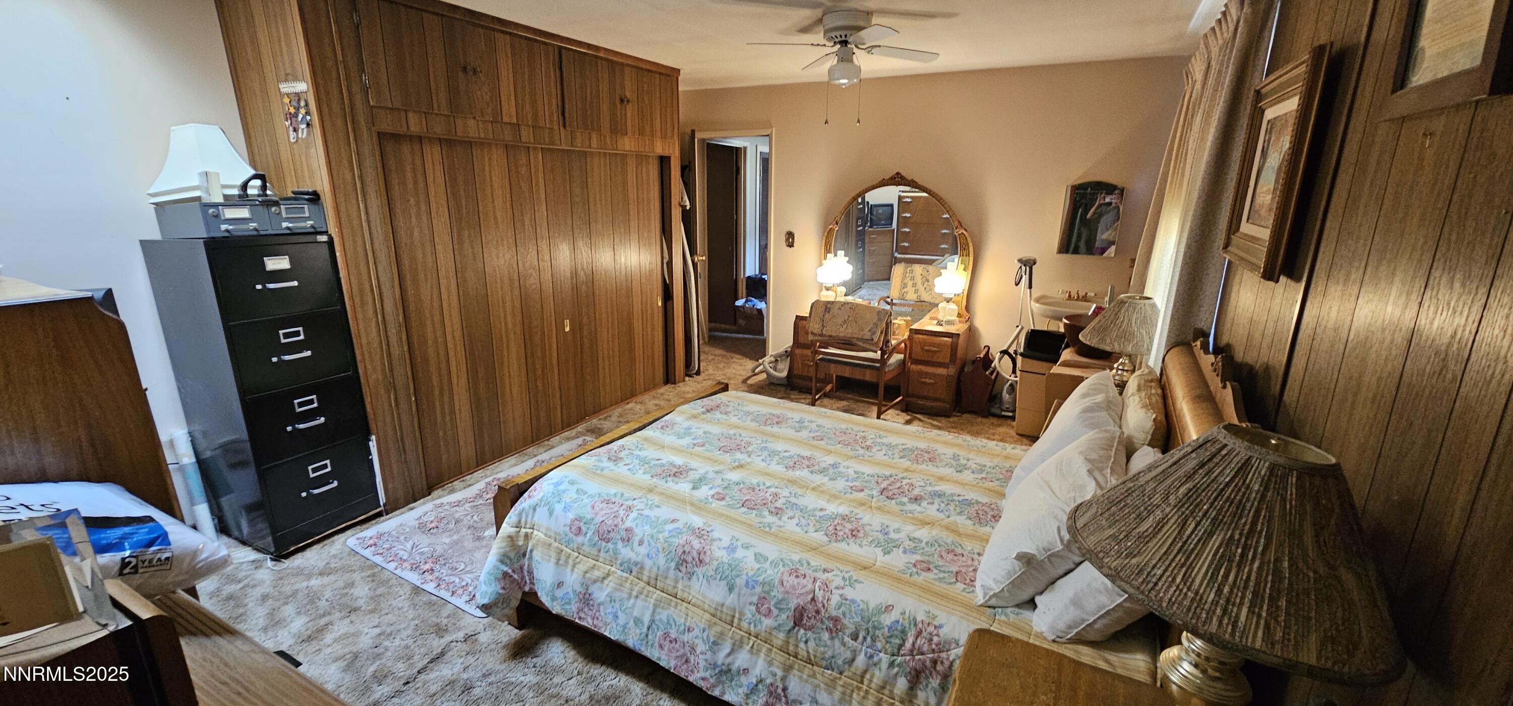316 Toiyabe Road Kingston, NV 89310 - Photo 25 of 32 a bedroom with a bed and a mirror
