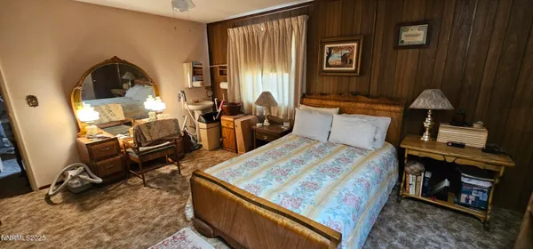 a living room with furniture rug and wooden floor