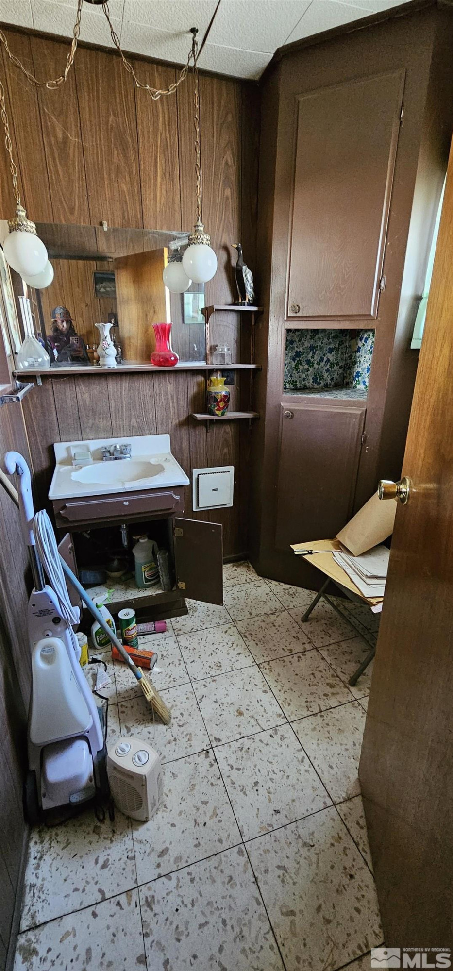 316 Toiyabe Road Kingston, NV 89310 - Photo 30 of 32 a kitchen with a sink a stove and a wooden cabinets