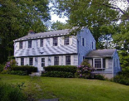 24 Brick School Road Warren, CT 06754 - Photo 1 of 1 a front view of a house with a garden