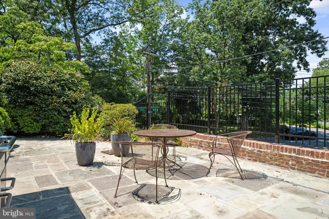 a view of a chairs and table in the patio