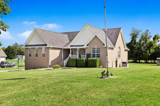 a view of a house with a yard