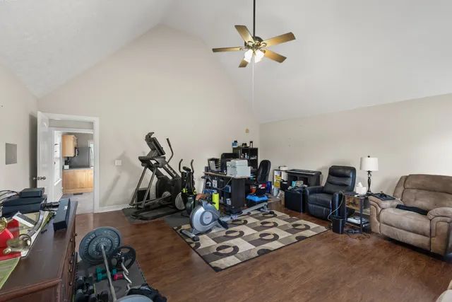 a view of a livingroom with furniture and a flat screen tv