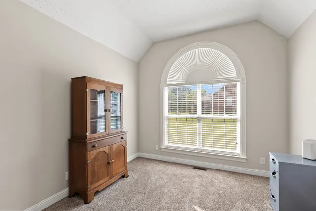 a view of empty room with windows