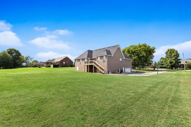 a view of a house with a big yard
