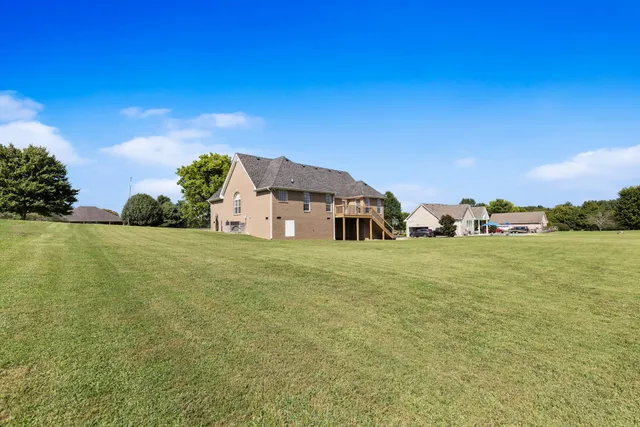 a view of a house with a big yard
