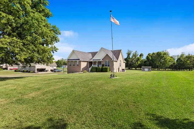 a front view of a house with garden