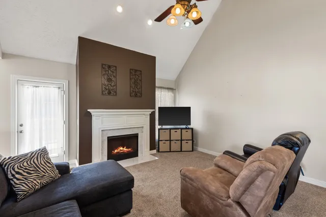 a living room with furniture and a fireplace