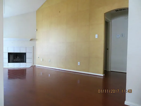 a view of a livingroom with furniture and window
