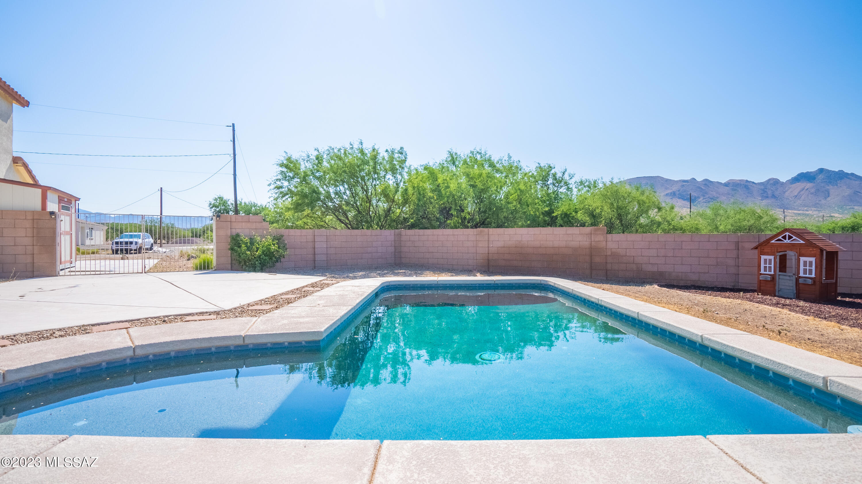 1858 Tijuana Court Rio Rico, AZ 85648 - Photo 14 of 33 a view of swimming pool with a yard