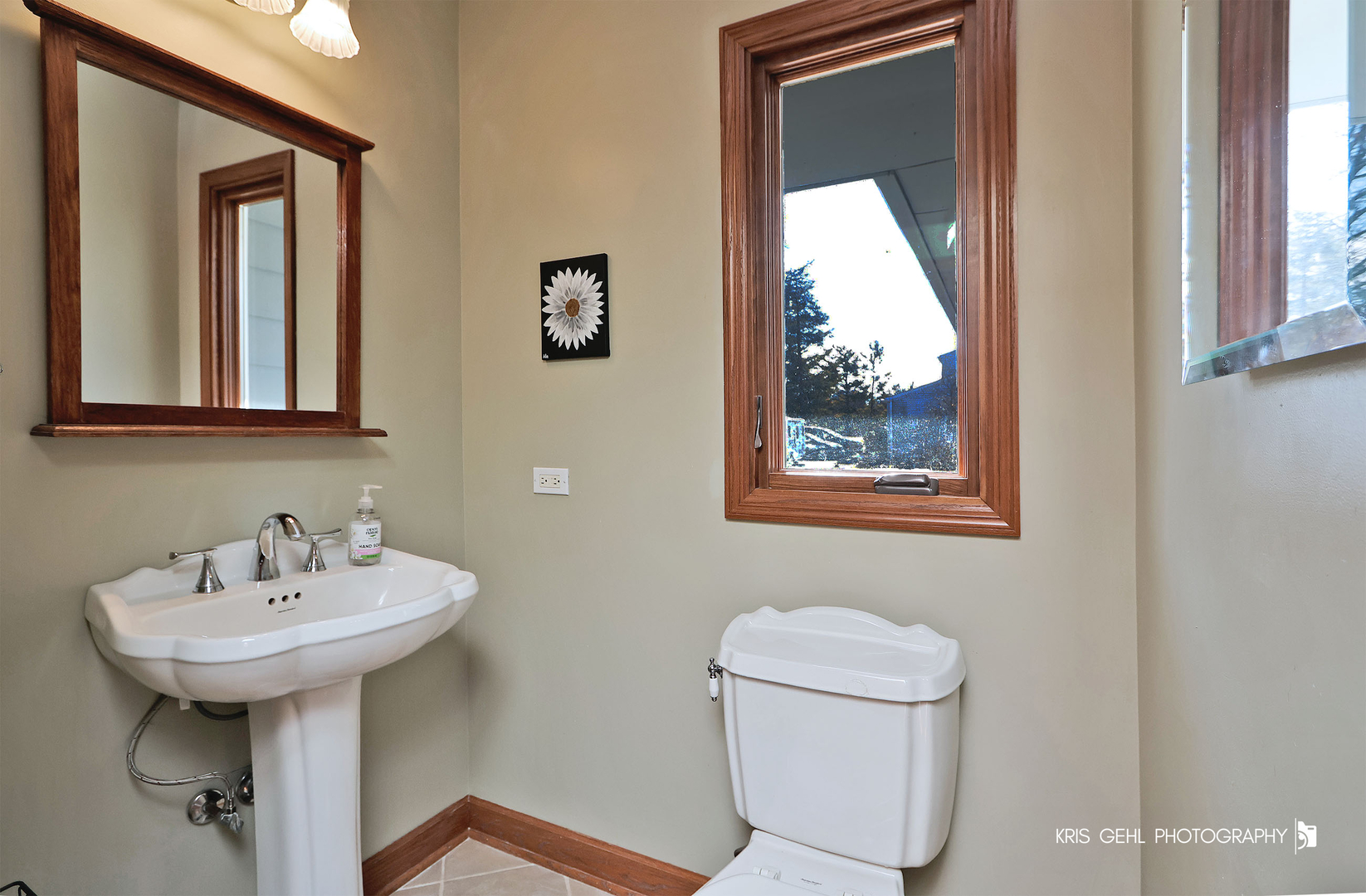 7149 Meadow Lane Cary, IL 60013 - Photo 12 of 37 a bathroom with a toilet sink and mirror