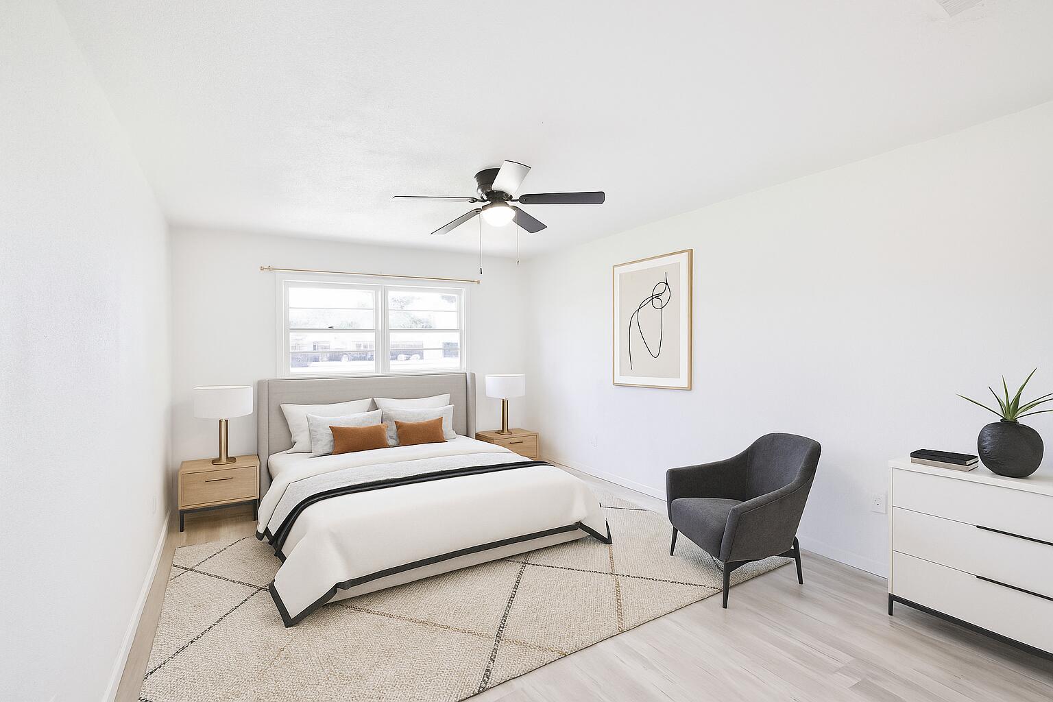 3812 31st Street Lubbock, TX 79410 - Photo 9 of 16 a bedroom with a bed and a chair