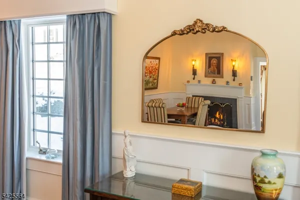 a living room with a fireplace and a window