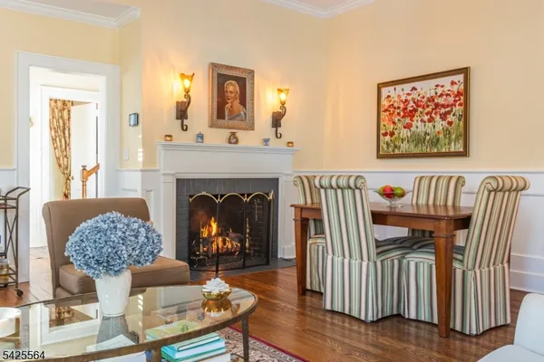 a living room with furniture a fireplace and a table