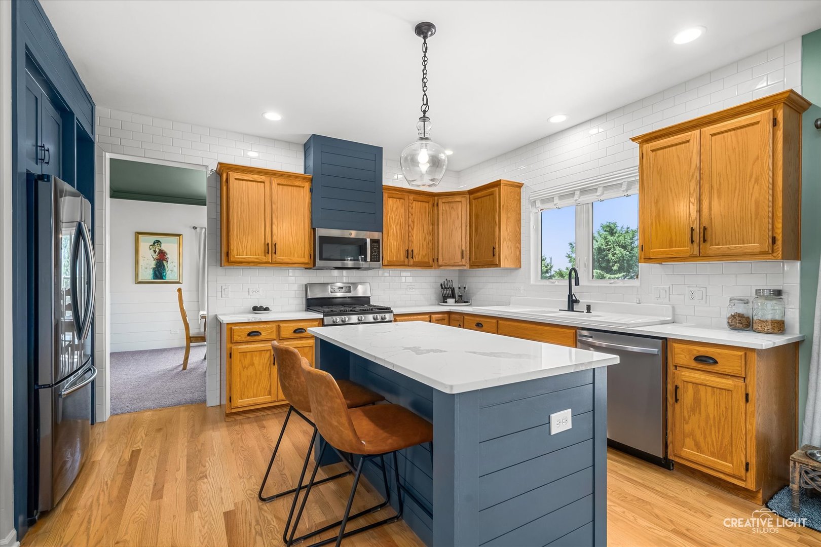 13495 Fennel Road Newark, IL 60541 - Photo 10 of 43 a kitchen with a sink a center island a counter space and a window