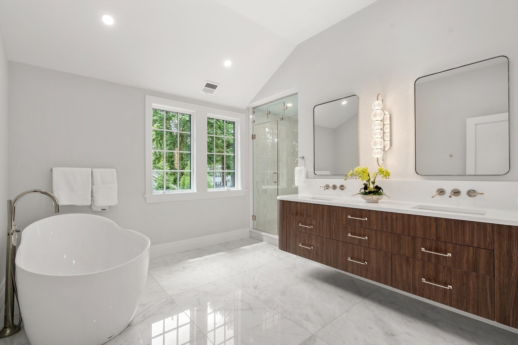 28 Parker Road Wellesley, MA 02482 - Photo 21 of 32 a spacious bathroom with a bathtub sink and mirror
